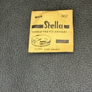 NOS STELLA 302 WRA Armed frette-Armiert.  Gilted. Watch crystal. Sealed packet.